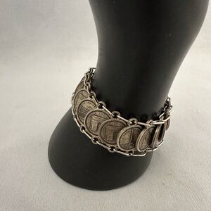 Vintage silver tone charm bracelet with souvenir Paris coins